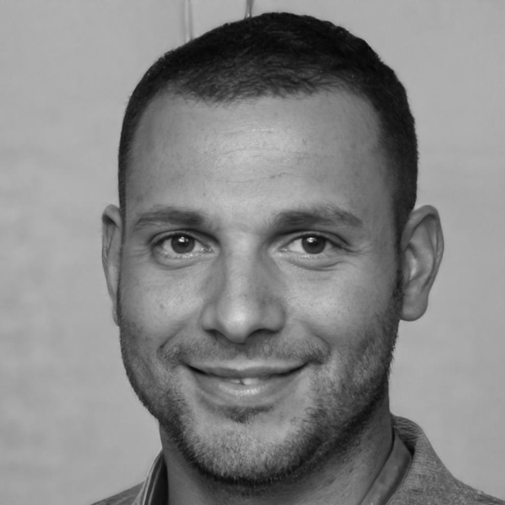 Portrait of male team member specializing in blockchain architecture and smart contract development